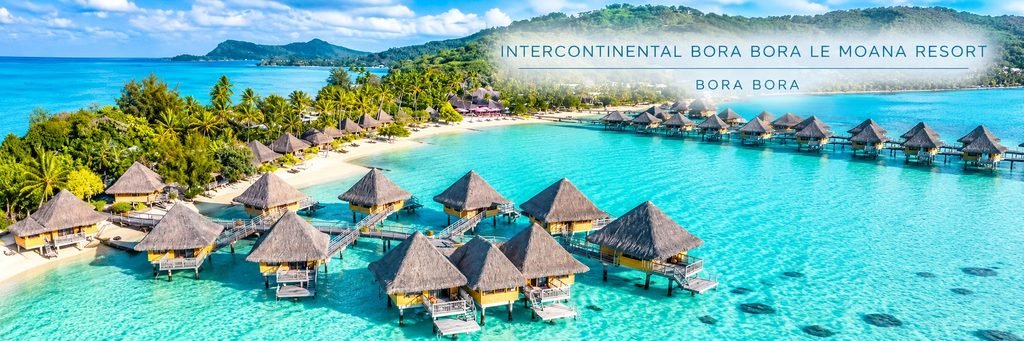 Aerial view of InterContinental Bora Bora Le Moana Resort featuring thatched-roof overwater bungalows, wooden walkways, a palm-lined beach, and turquoise lagoon waters.