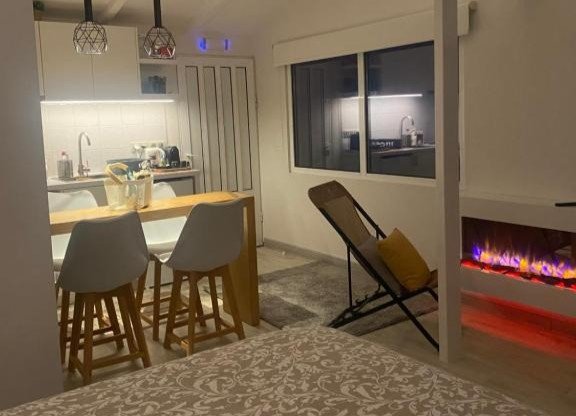 open plan kitchen and living space at Seaside 12 with modern decor and comfortable seating