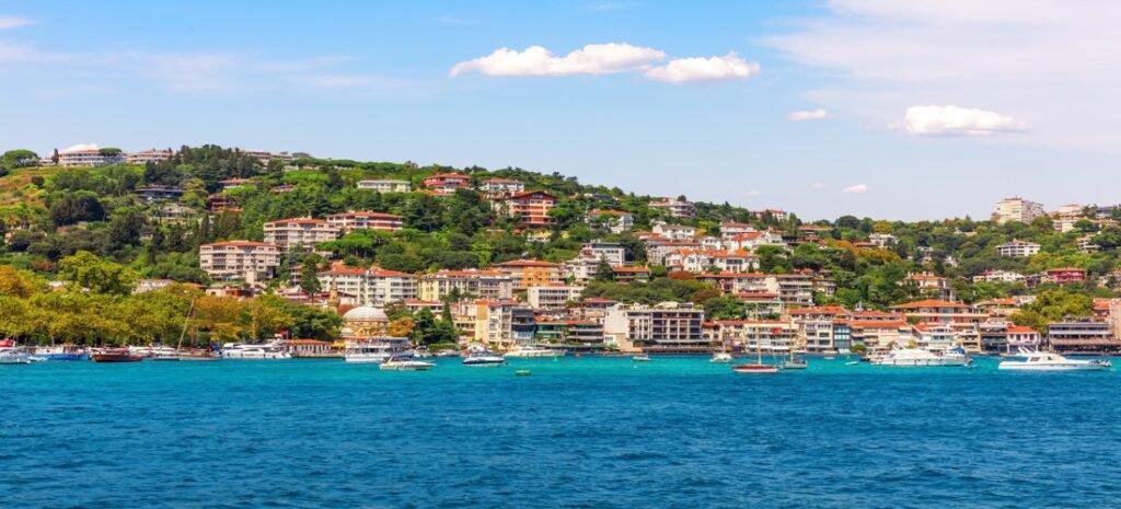 Colorful hillside homes and boats on the Bosphorus in Beautiful Istanbul, Turkey.