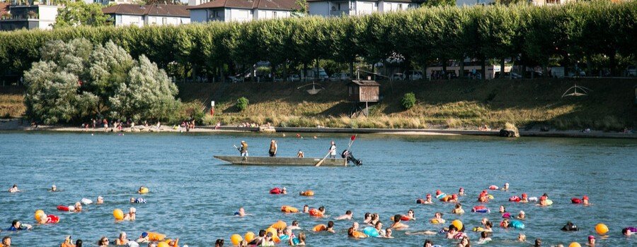 Swimmers take part in the annual Rhine River swim in Basel Switzerland