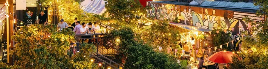 Outdoor dining and colorful urban garden atmosphere at Frau Gerolds Garten in Zurich