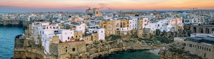 Bari Vecchia old town buildings perched on cliffs above the Adriatic Sea