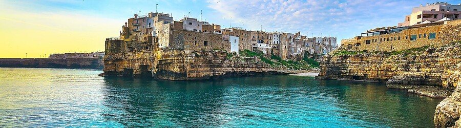 Polignano a Mare coastline with turquoise water and cliffside old town