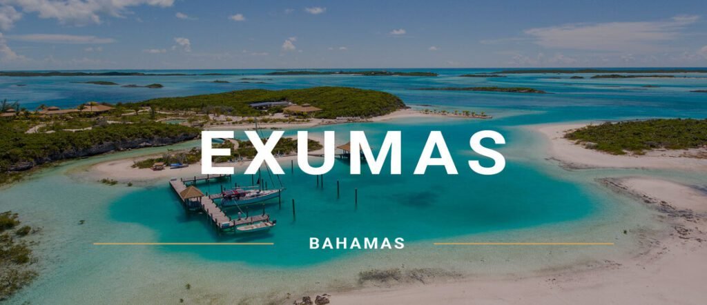 Aerial view of the Exumas with bright turquoise water, small islands, and a wooden dock.