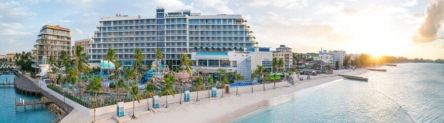 Oceanfront Margaritaville Beach Resort in Nassau at sunset.