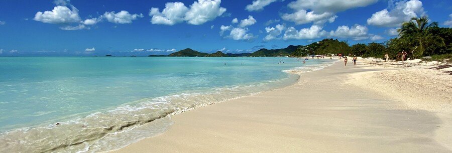 Antigua and Barbuda beach with white sand, turquoise water, and tropical coastline