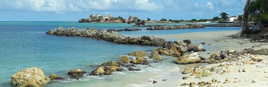 Runaway Beach Antigua and Barbuda with turquoise water and rocky shoreline
