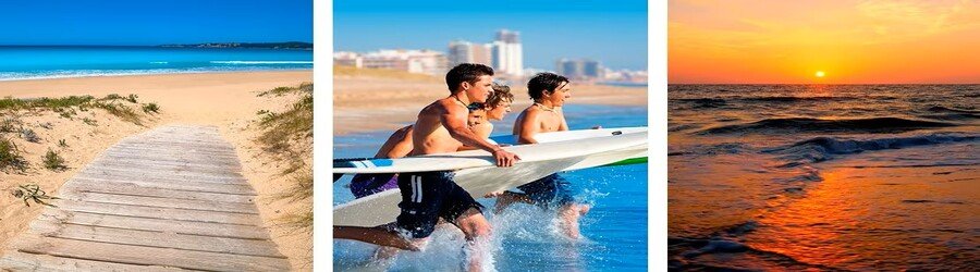 Wooden boardwalk leading to a sandy Spain beach, surfers running into the water, and a bright sunset over the waves.
