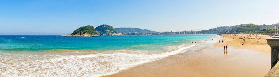Playa de la Concha San Sebastian Spain golden beach with turquoise water and promenade