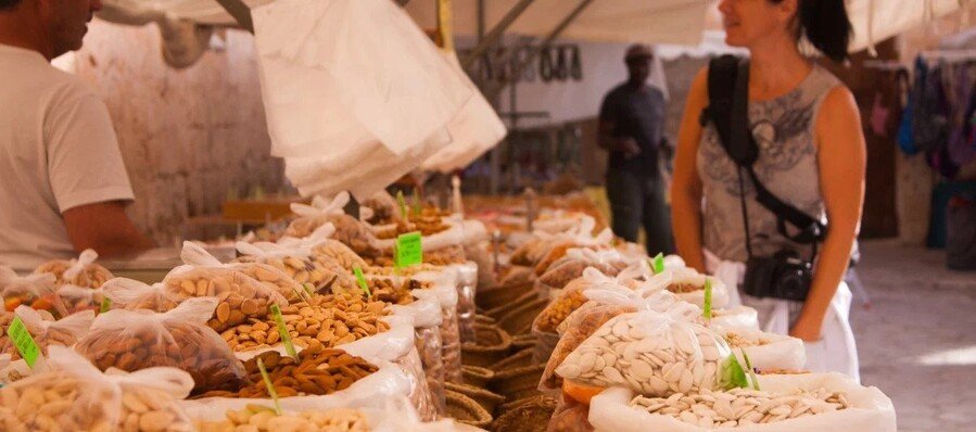 Local food market in Mallorca with traditional nuts spices and fresh products Balearic Islands Spain