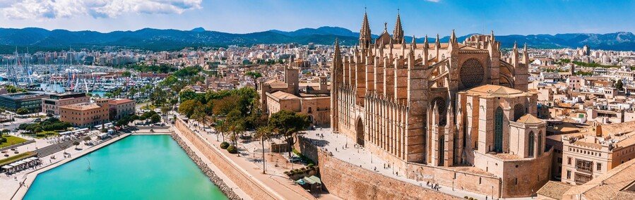 Palma Cathedral in Mallorca overlooking marina and Mediterranean coastline in the Balearic Islands Spain