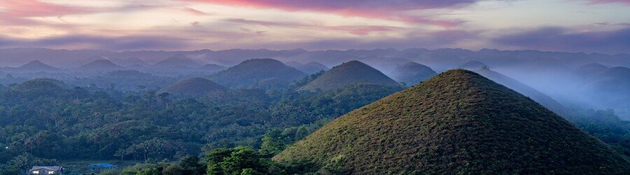 Chocolate Hills in Bohol with rolling hills and soft morning light