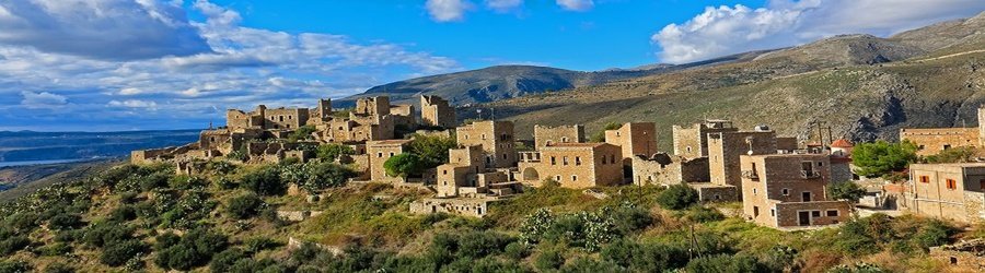 Tranquil islet connected by a narrow stone path near Gythio, Peloponnese, Greece.