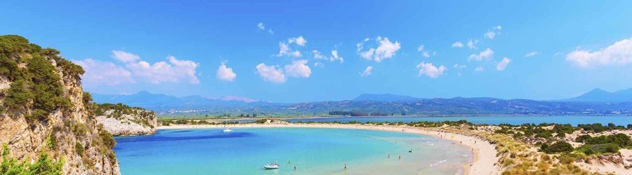 Voidokilia Beach with its perfect semicircle of golden sand and turquoise water in Messenia, Peloponnese.