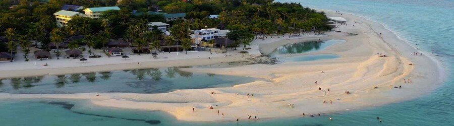 Bantayan Island sandbar with shallow turquoise water and palm-lined shoreline in Cebu Philippines