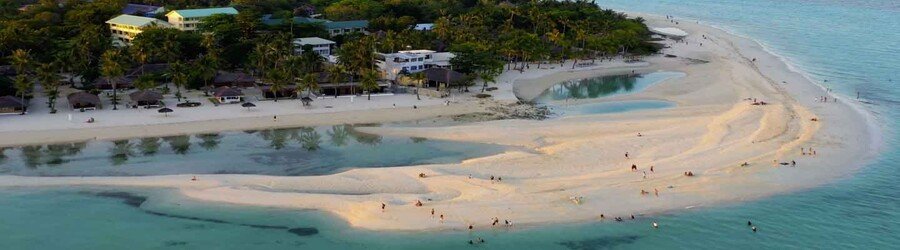 Aerial view of a wide sandbar and shallow lagoon on Bantayan Island surrounded by white sand beaches