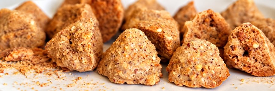 Close-up of traditional Bohol Peanut Kisses, golden-brown peanut cookies shaped like miniature Chocolate Hills, with a crumbly, textured surface.