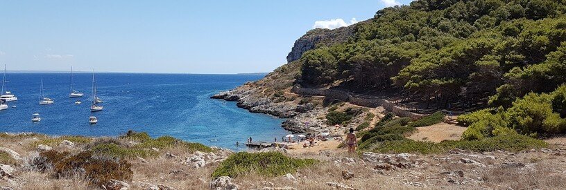 Cala Minnola beach in Levanzo with clear water and rocky coastline