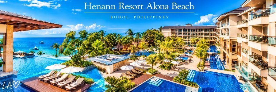 Henann Resort Alona Beach in Panglao, Bohol, featuring sparkling blue swimming pools, tropical palm gardens, luxury accommodations, and ocean views.