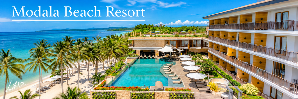 Modala Beach Resort in Panglao, Bohol, featuring a turquoise swimming pool, luxury beachfront accommodations, palm-lined white sand, and beautiful ocean views.
