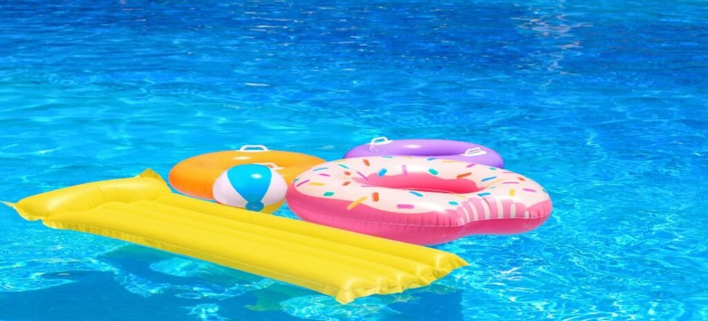Colorful pool floats and loungers floating in the water – the best inflatables for the beach to relax, play, and enjoy sunny days.