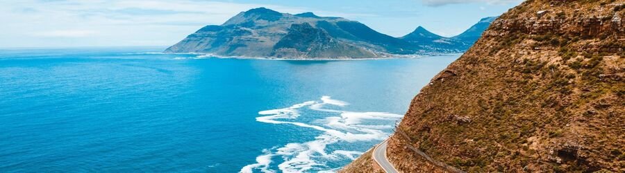 Aerial view of Cape Town South Africa with Lion’s Head and Table Mountain above the coast.