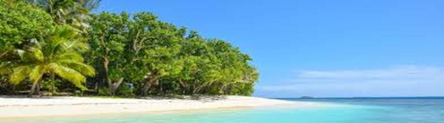 Quiet tropical beach with turquoise water in the Cook Islands