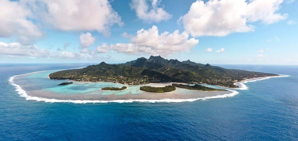 Aerial view of Rarotonga surrounded by turquoise lagoon in the Cook Islands