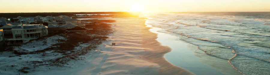 sunrise over grayton beach florida with soft waves and coastal dunes