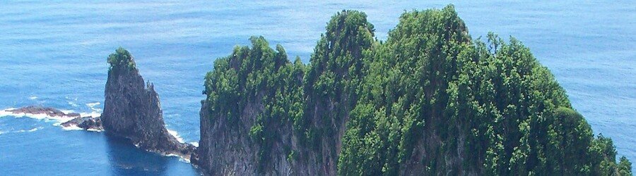 Rocky island cliffs in the National Park of American Samoa.