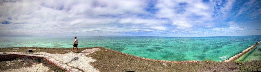 Visitor overlooking the endless turquoise sea at Dry Tortugas National Park.