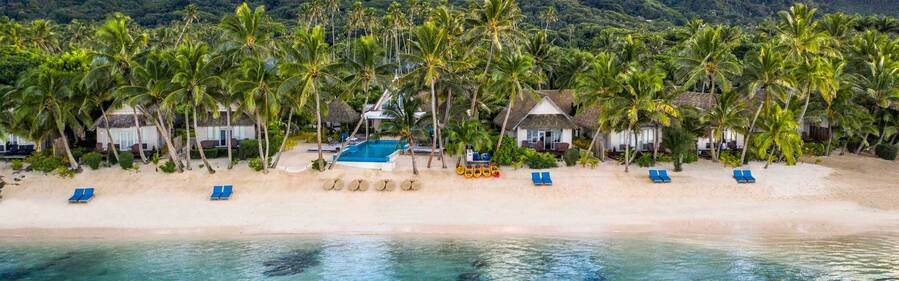 Little Polynesian Resort beachfront bungalows and pool on Titikaveka Beach Rarotonga
