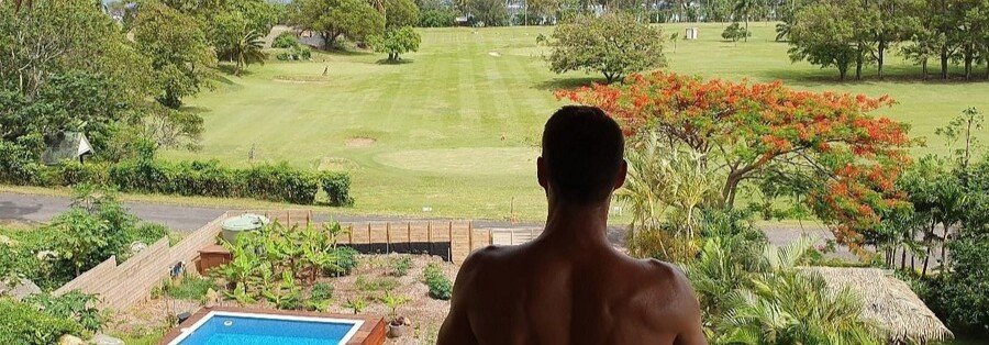 Rainbow Villas Rarotonga balcony view over pool and tropical gardens