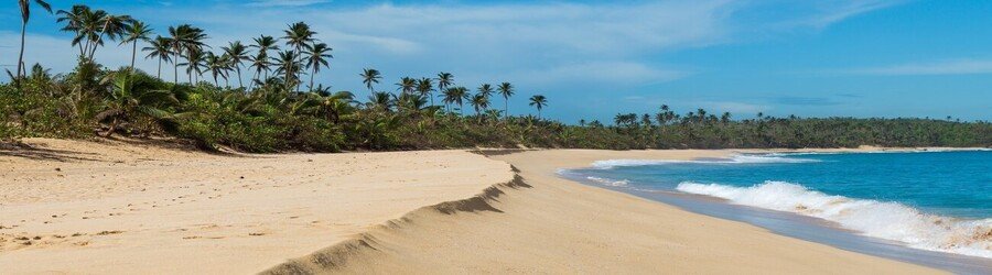 Condado Beach in San Juan Puerto Rico with golden sand and turquoise waves