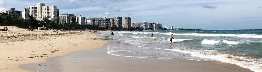 Ocean Park Beach San Juan with soft waves and beachfront skyline