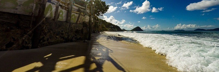 Atlantic waves breaking along the narrow shoreline at Apple Bay