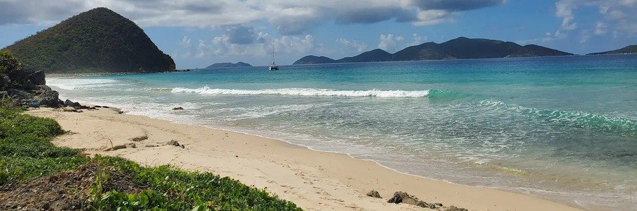 Long Bay Beach in Tortola’s West End with waves and island views