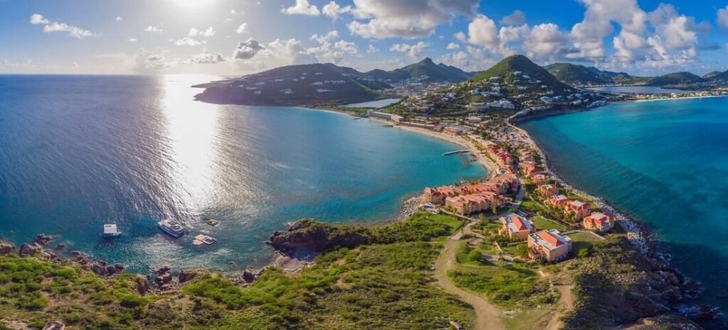 Aerial view of green hills, coastal bays, and turquoise water in Tortola
