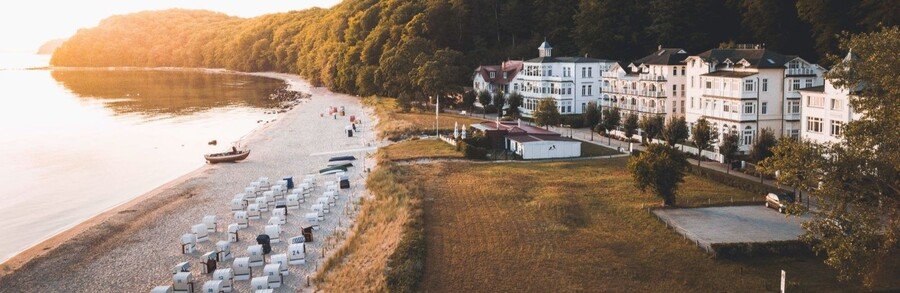 Binz Beach on Rügen Island Germany with white seaside villas and traditional Strandkorb beach chairs along the Baltic coast