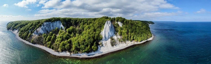 White chalk cliffs at Jasmund National Park on Rügen Island Germany overlooking the Baltic Sea coastline.