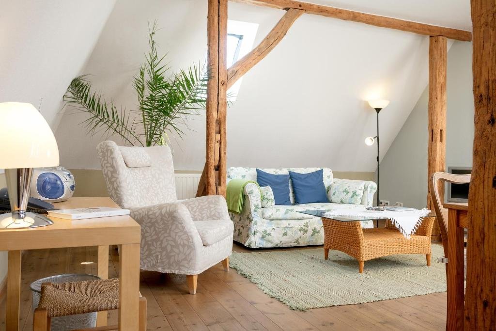 Cozy loft sitting area at Gutshaus Ketelshagen in the Rügen countryside