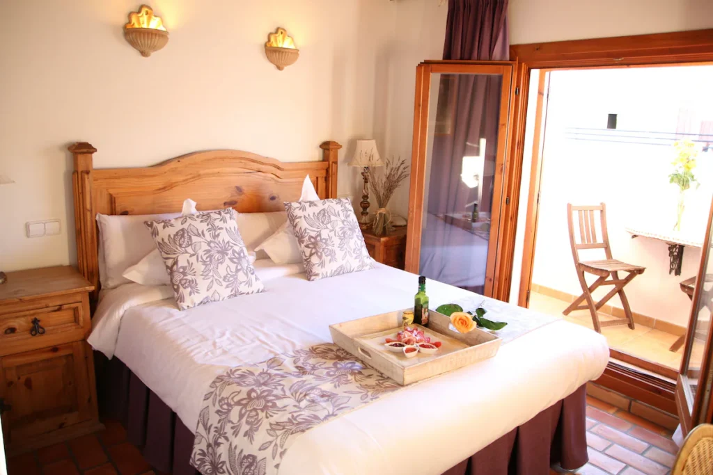 Hotel Abaco Altea Spain cozy guest room, kitchen, and living space with warm design and traditional style