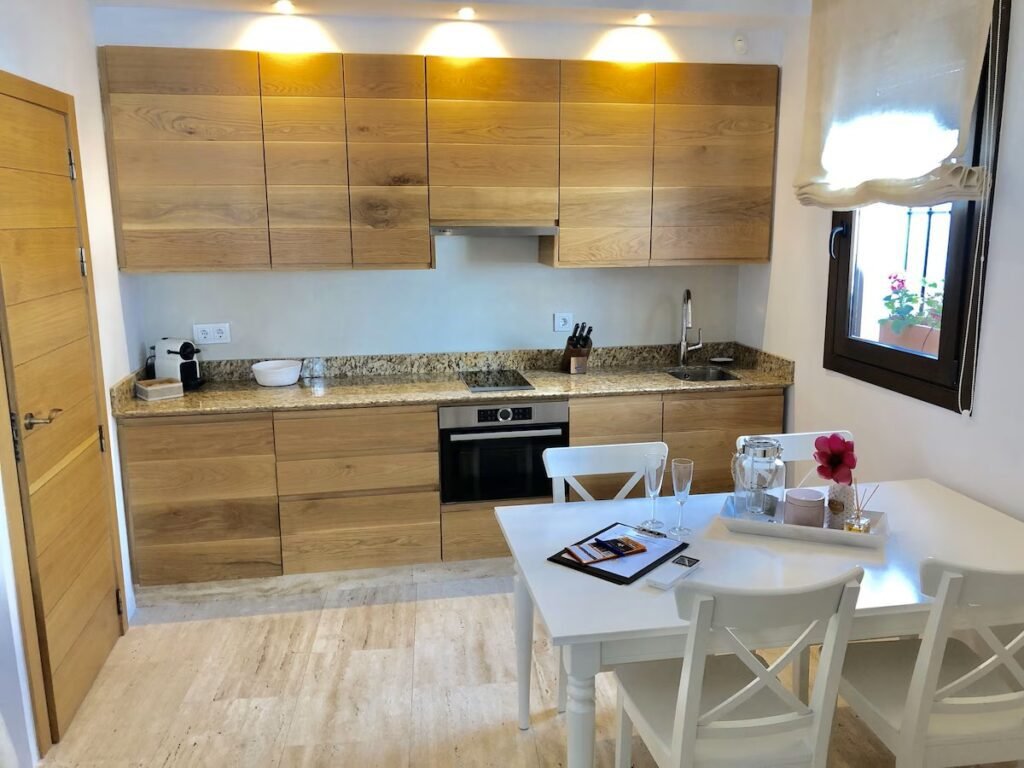 Hotel Abaco Altea Spain cozy guest room, kitchen, and living space with warm design and traditional style