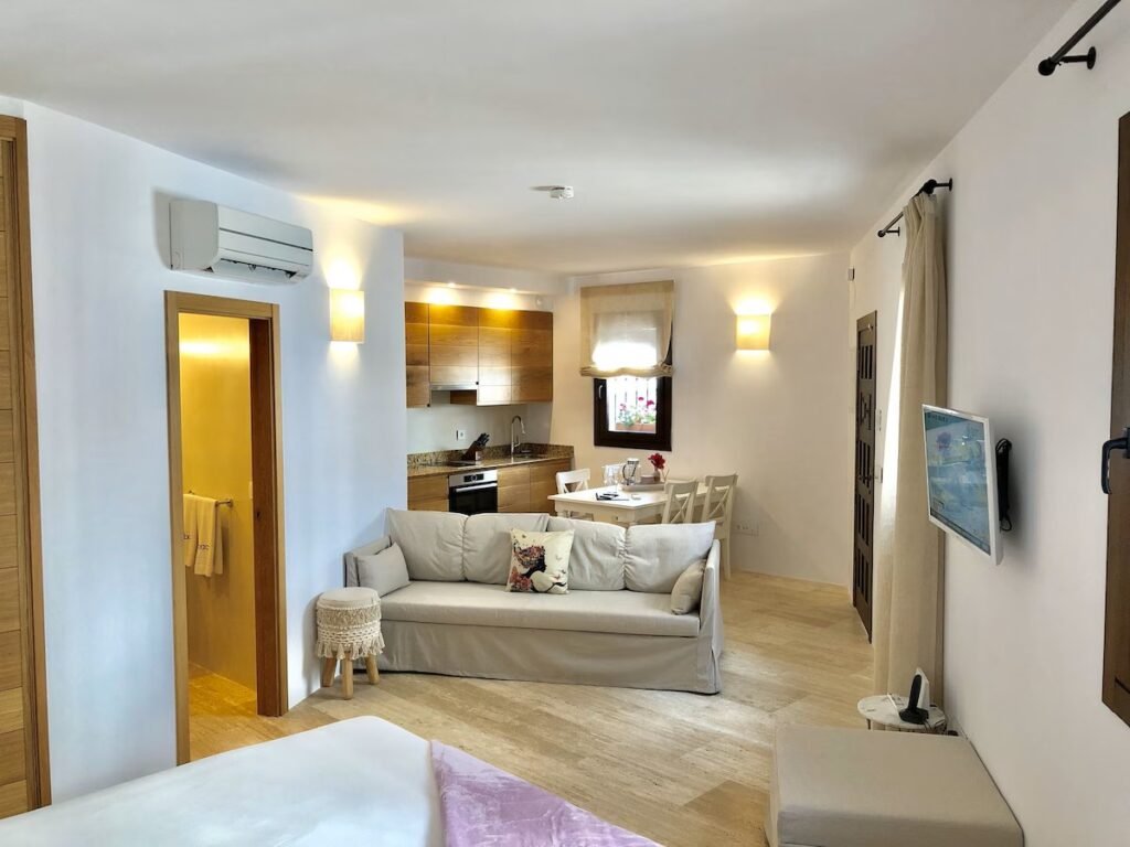 Hotel Abaco Altea Spain cozy guest room, kitchen, and living space with warm design and traditional style