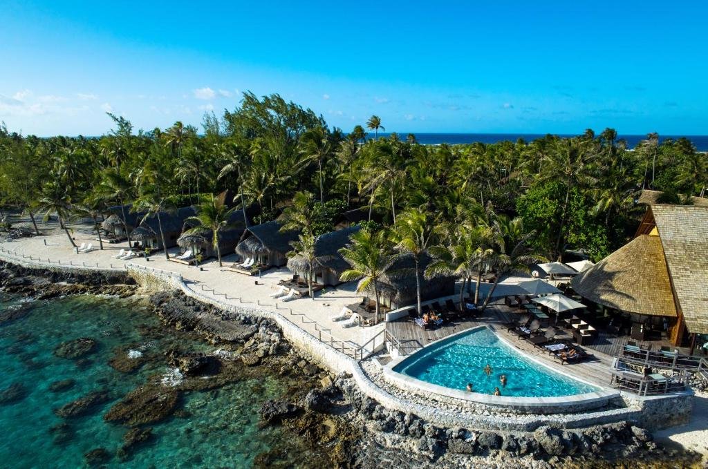 Beachside pool and lagoon view at Maitai Rangiroa resort