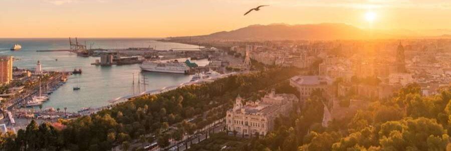 Barcelona cruise port at sunset with harbor, city skyline, and cruise ships