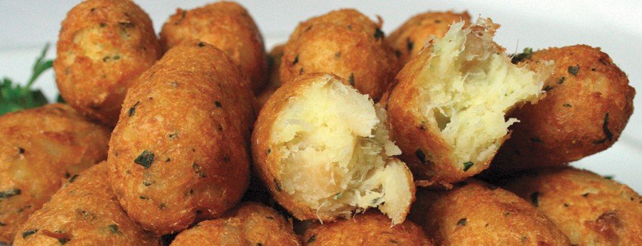 Bolinhos de bacalhau Brazilian codfish fritters with crispy golden exterior and soft flaky cod filling.