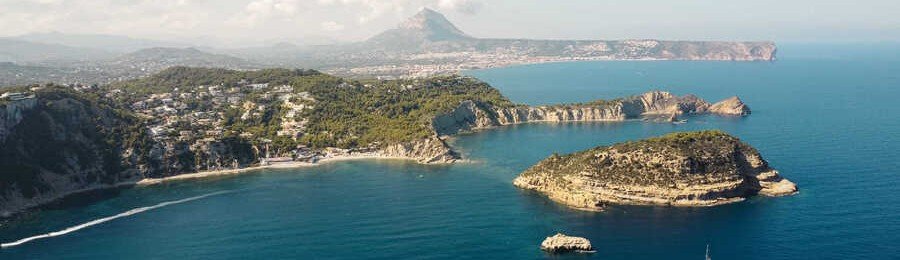 Scenic coastline of Javea Xabia Spain with rocky coves, cliffs, and turquoise Mediterranean Sea