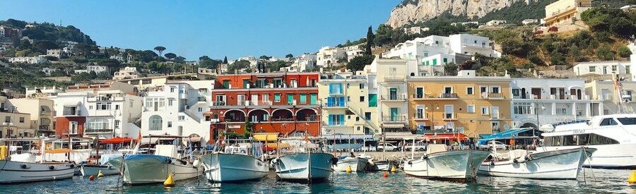 Naples Italy waterfront marina with boats and coastal buildings
