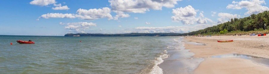 Prora beach on Ruegen Island Germany along the Baltic Sea with sandy shoreline and calm coastal waters.